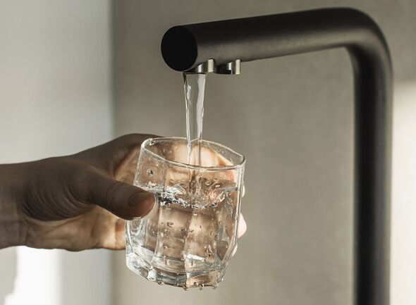 Drinking water. Fill the glass with tap water