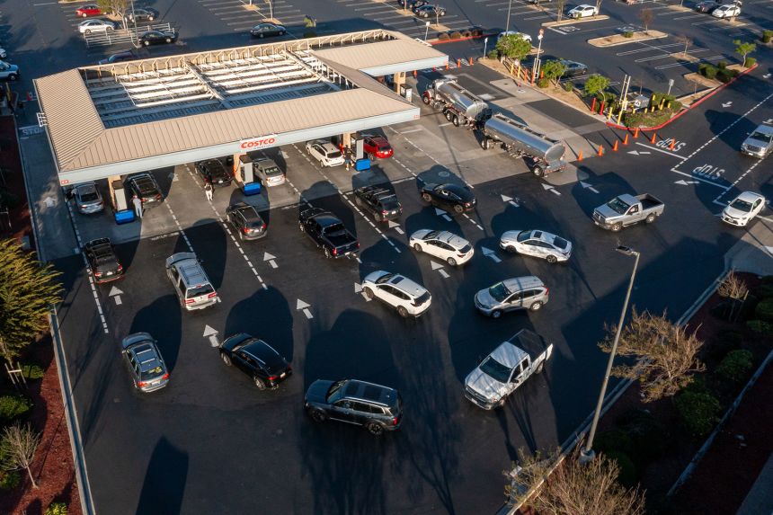 Drivers wait to load vehicles at a Costco gas station in Richmond, California.