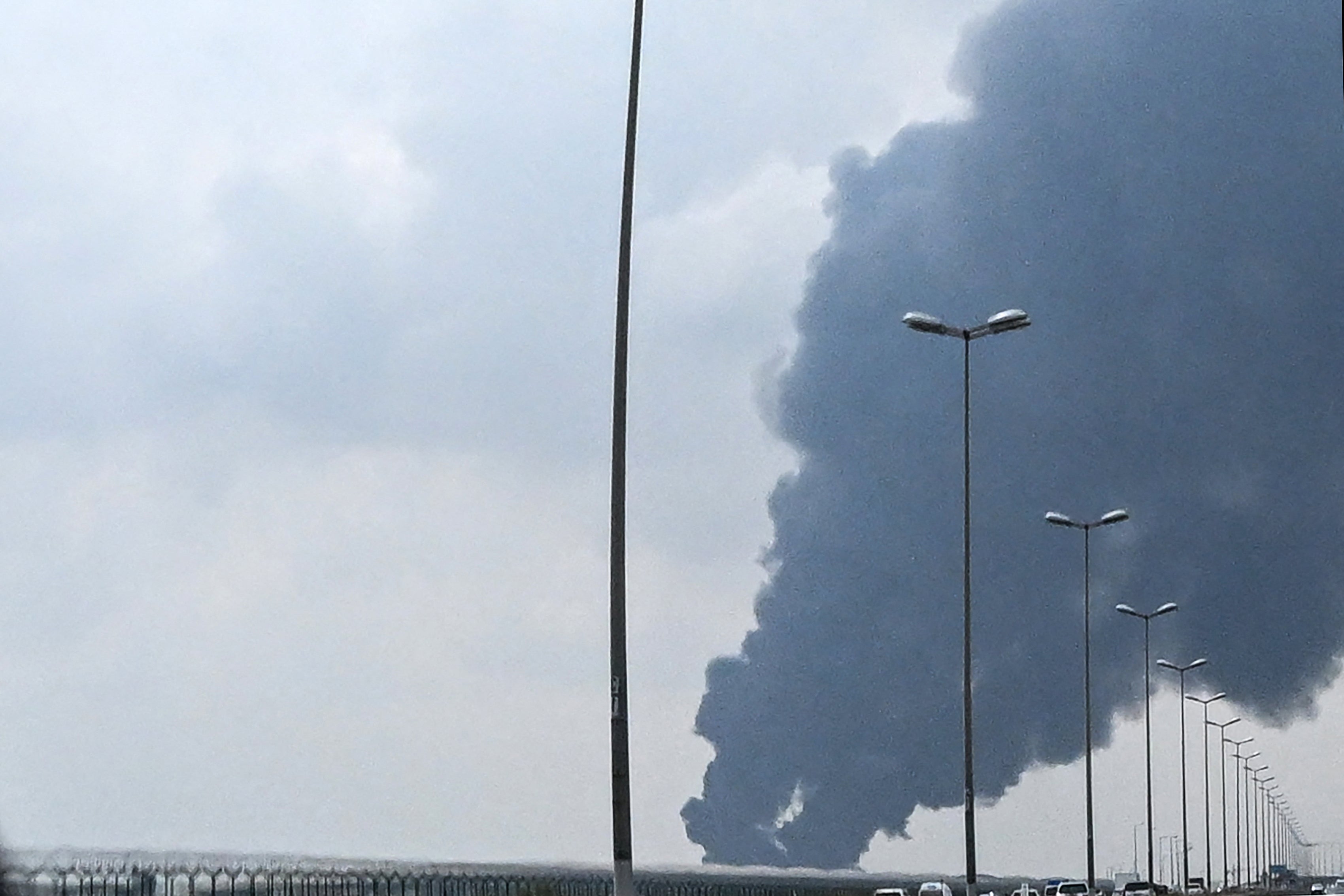 Smoke rises from the area of Kuwait International Airport after a reported drone strike hit a fuel depot on March 25.