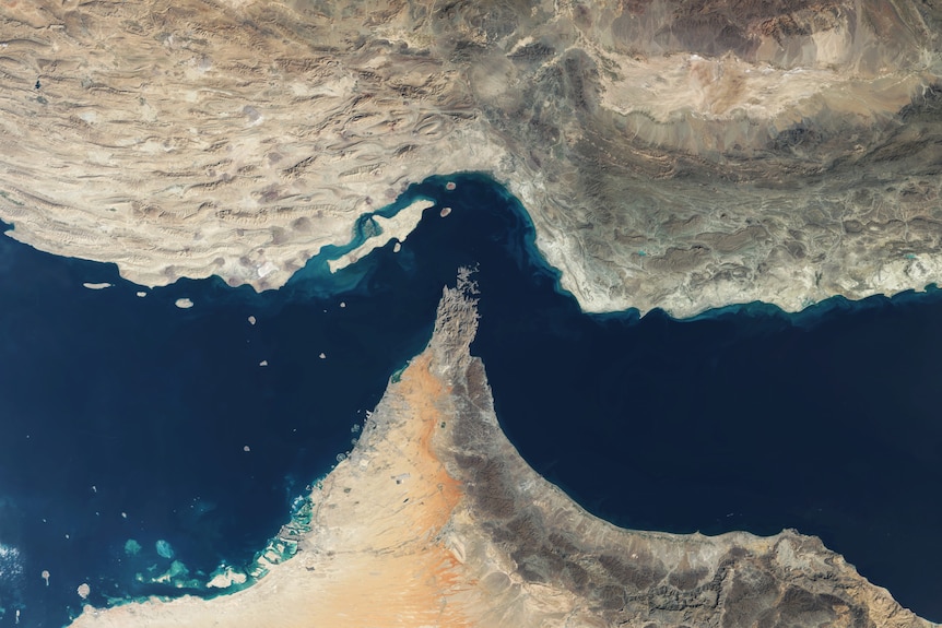 A satellite image showing a body of water surrounded by two countries.