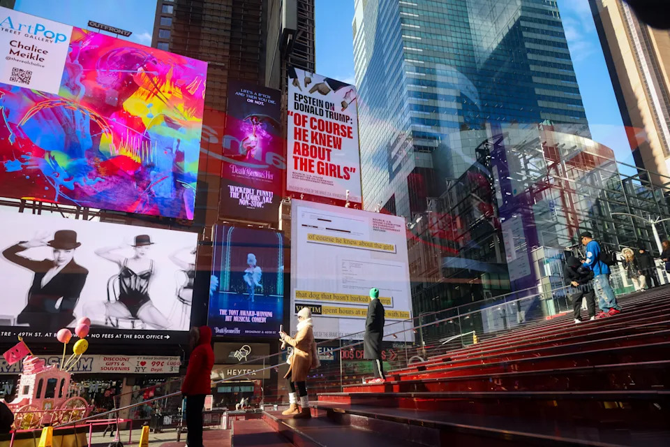Times Square with colorful digital billboards, red carpets, and a mix of dynamic ads